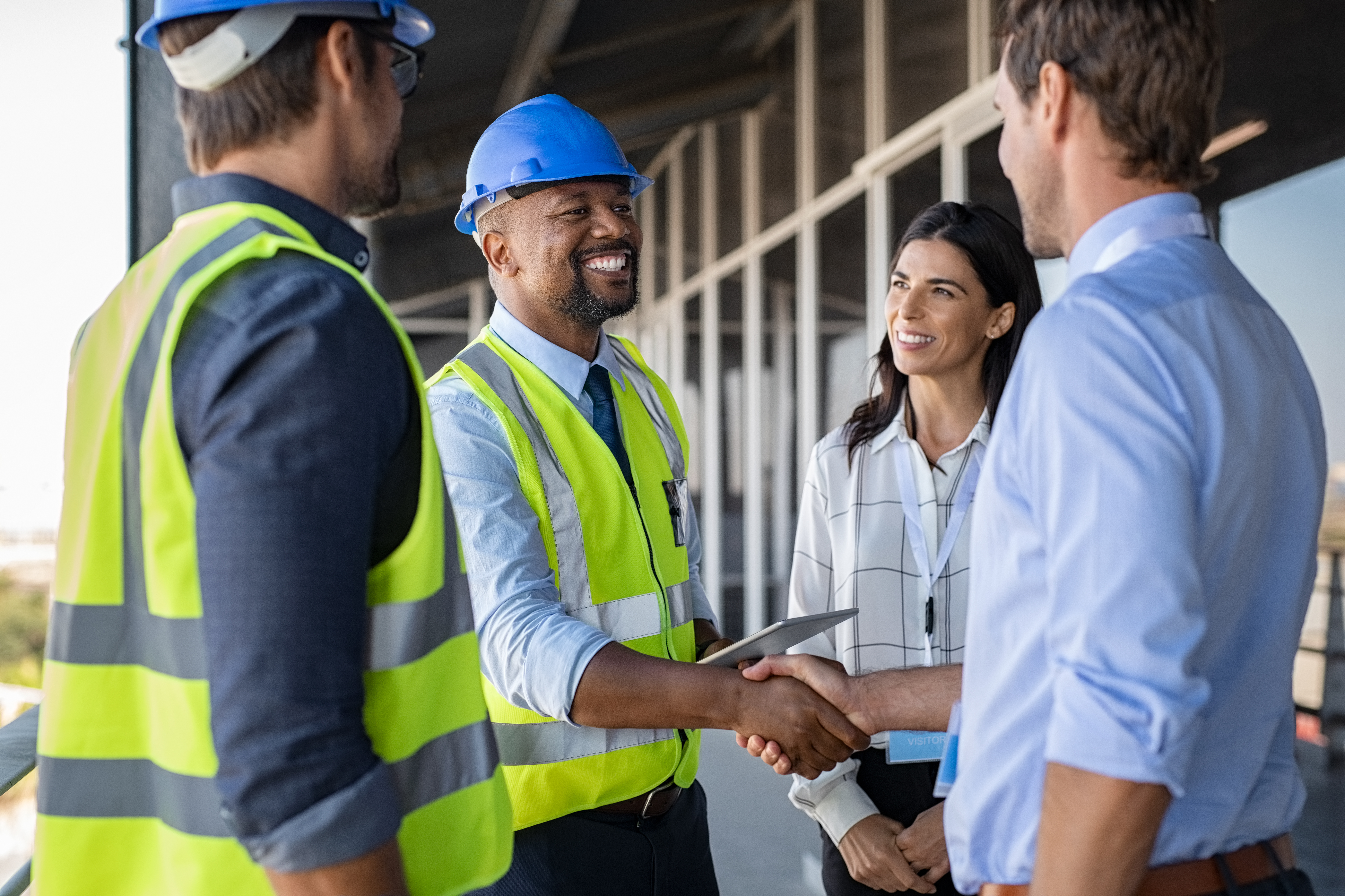 Engineers, project managers, and customers shaking hands